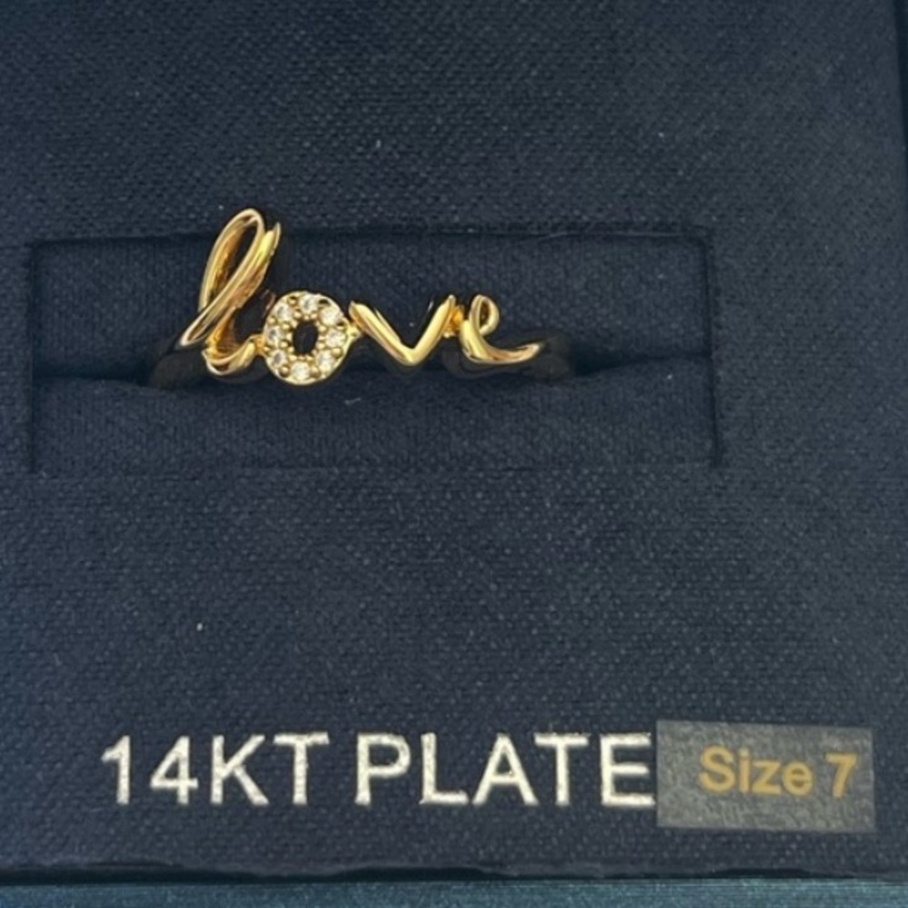 New 14k gold plated “LOVE” ring. Size 7. Feminine. Classic. Perfect gift!